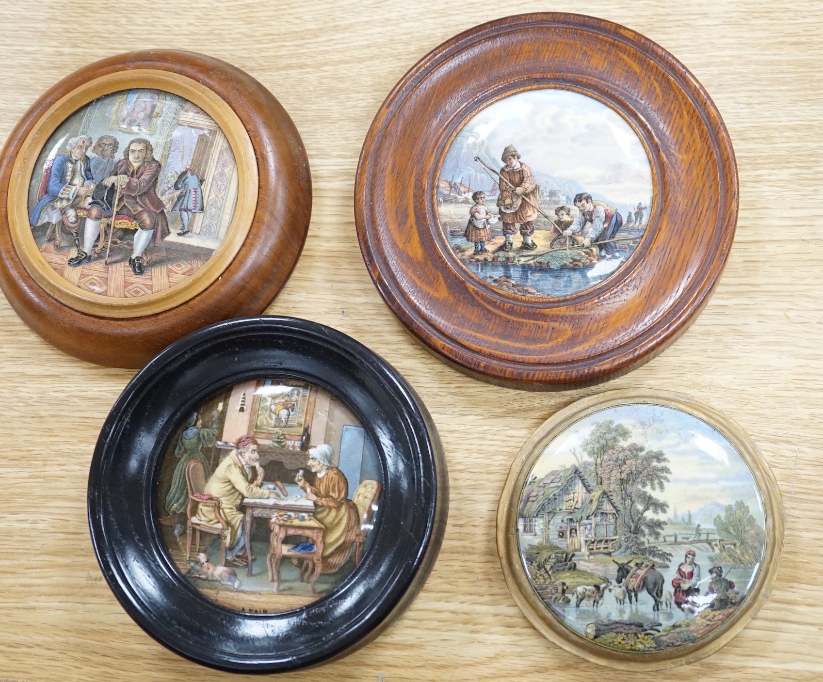 A collection of sixteen mainly 19th century Prattware pomade pot lids